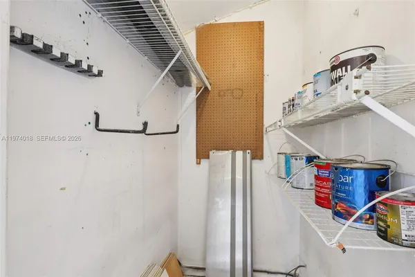 a view of storage and utility room with two washing machine