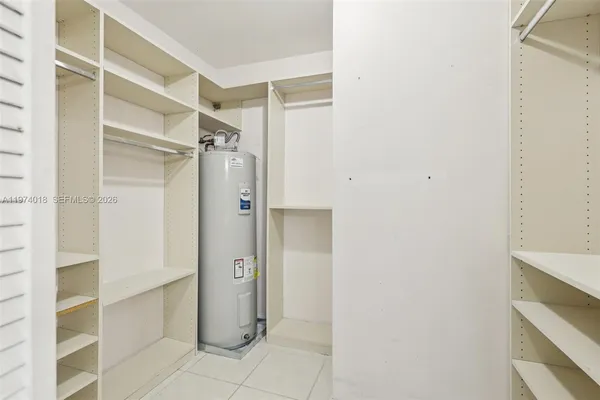 a bathroom with a shower and a glass door