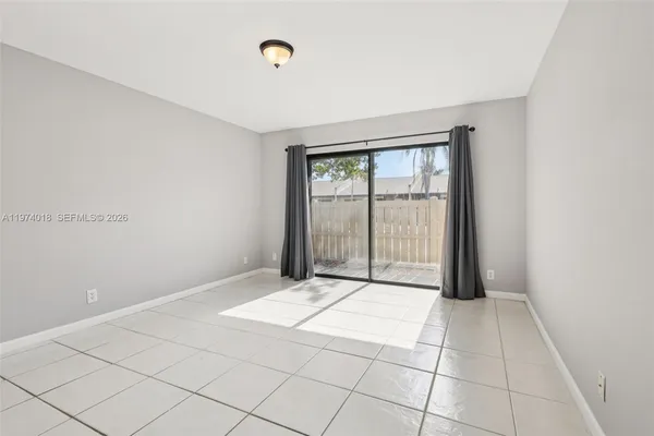 a view of an empty room and window