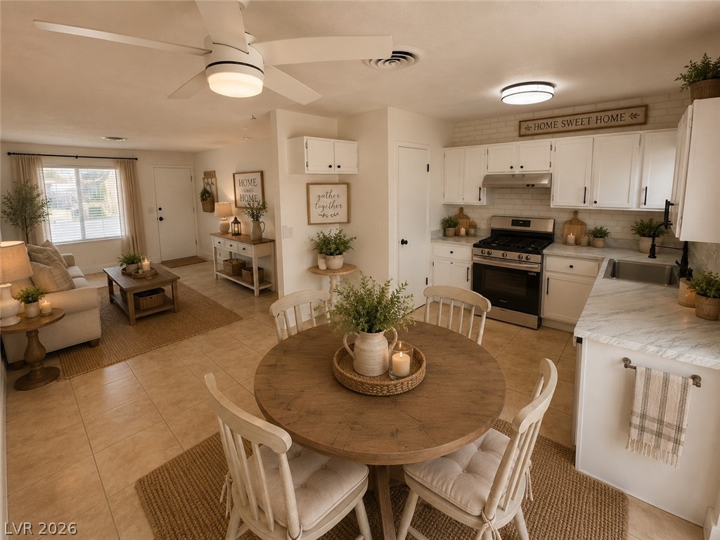 4048 Maple Hill Road Las Vegas, NV 89115 - Photo 3 of 40 Virtually Staged. An open layout connects the casual dining area directly to the kitchen and living spaces.
