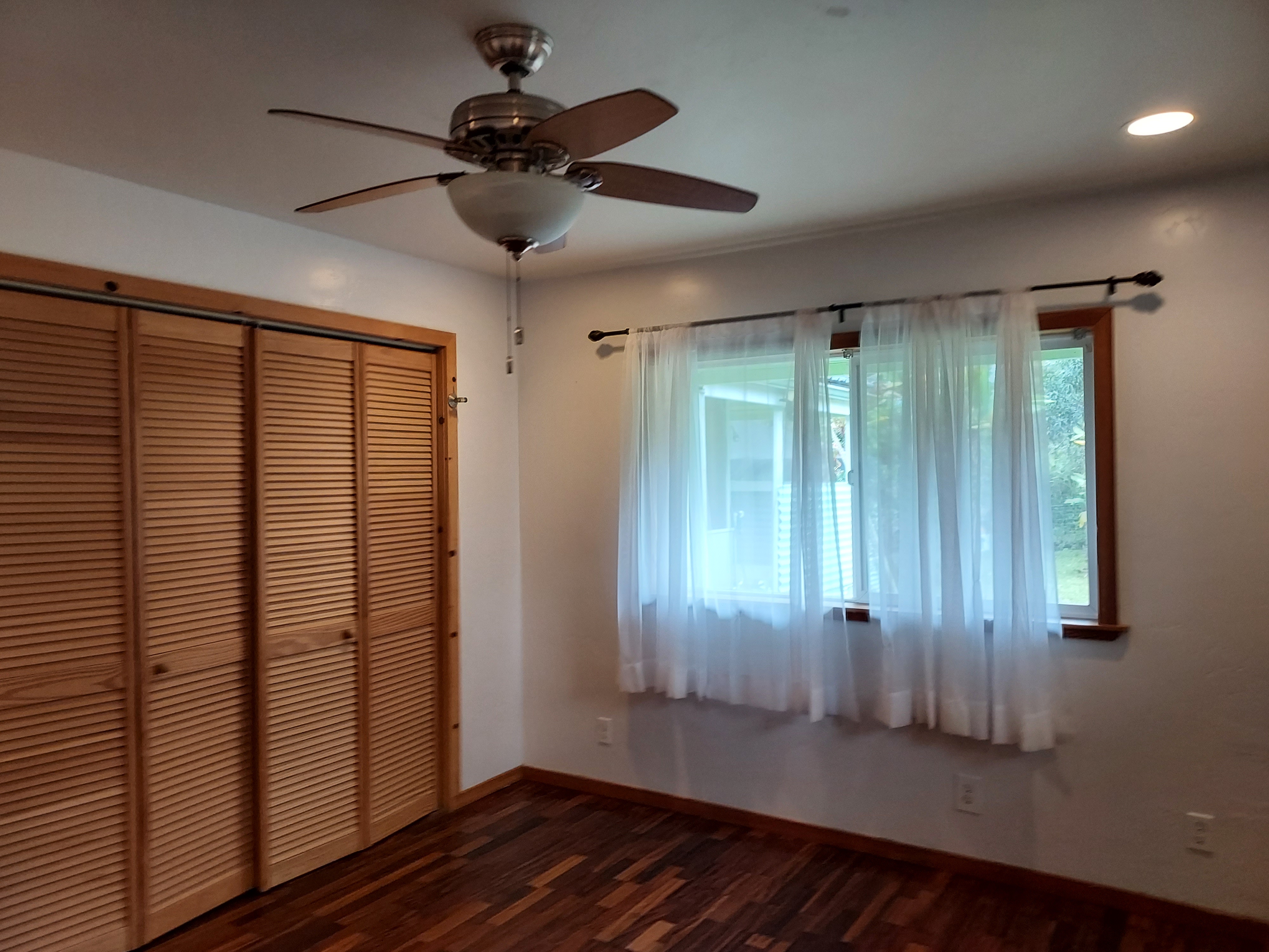 14-3431 Seadrift Road Pahoa, HI 96778 - Photo 15 of 22 wooden floor in an empty room with a window