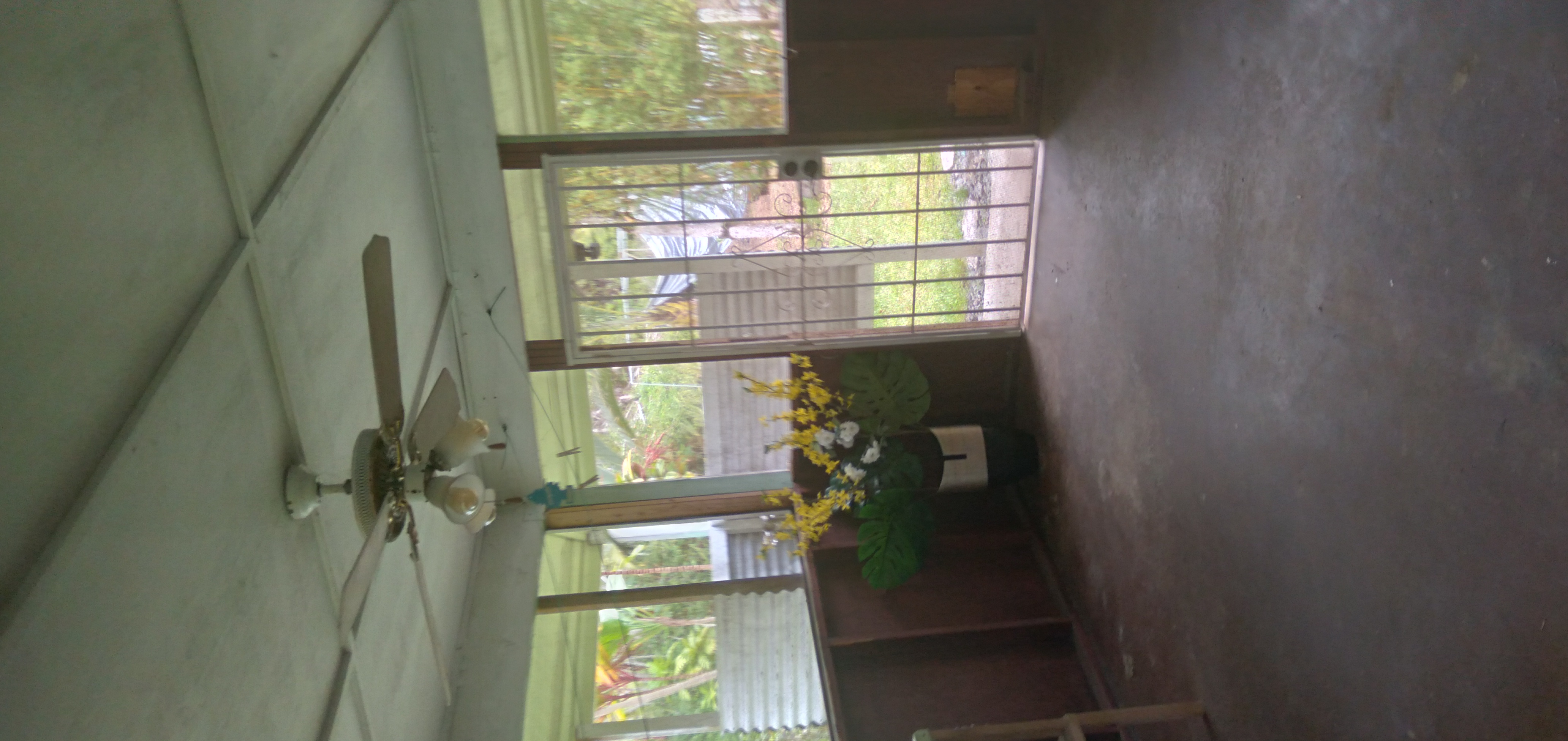 14-3431 Seadrift Road Pahoa, HI 96778 - Photo 18 of 22 a living room with furniture and a floor to ceiling window