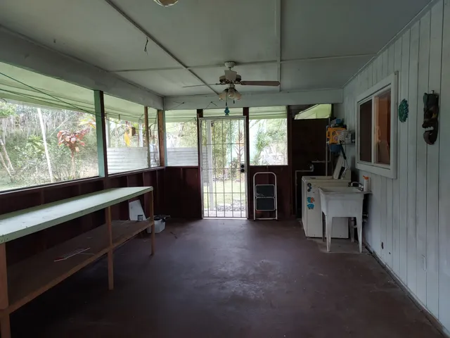 a view of a livingroom with furniture and a window