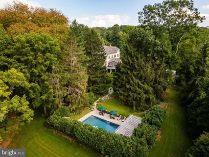 a view of a dining room with furniture and window