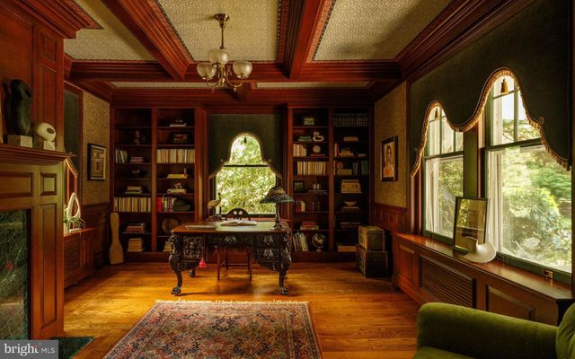 a bathroom with a sink vanity mirror and toilet
