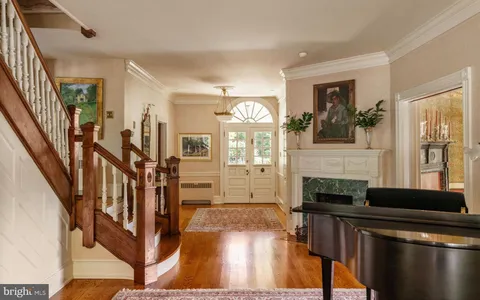 a bathroom with a bathtub and a window