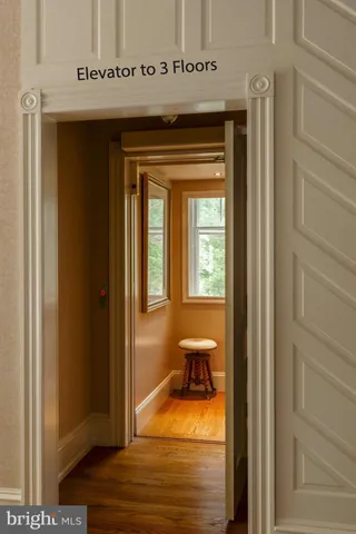 a view of a livingroom with furniture and a window