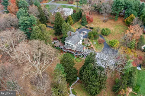 a living room with furniture a window and a fireplace