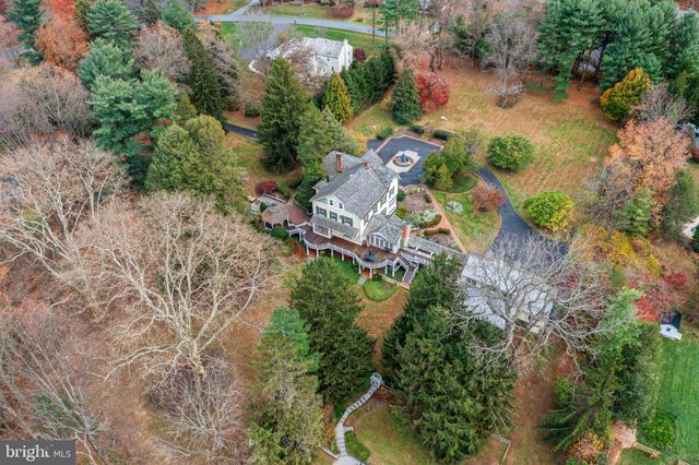 a living room with furniture a window and a fireplace