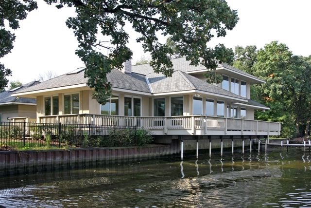 a front view of a house with a lake view