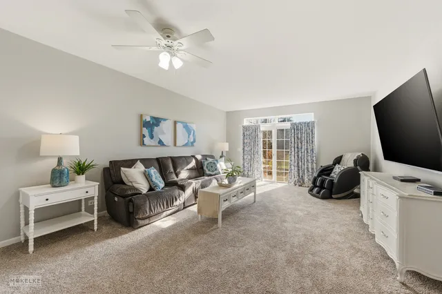 a bathroom with a toilet and a shower curtain