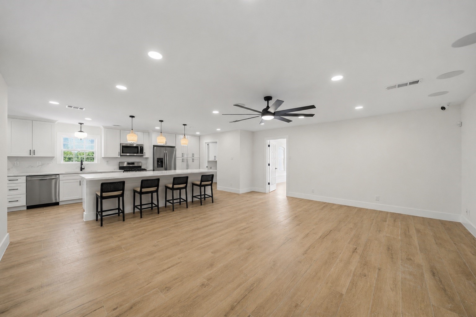 18918 Casper Drive Spring, TX 77373 - Photo 13 of 32 The open concept layout allows the kitchen to remain connected to the dining and living spaces so you never miss a moment. This photo has been virtually staged.