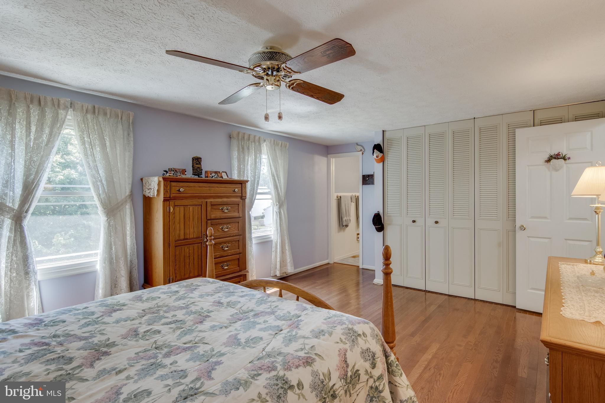 5 Tulip Tree Court Baltimore, MD 21221 - Photo 20 of 40 Master bedroom wall of closets, ceiling fan