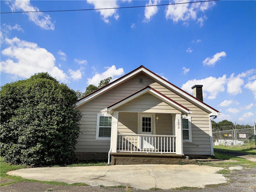 3072 Maysville Road Commerce, GA 30529 - Photo 1 of 1 a front view of a house with a yard
