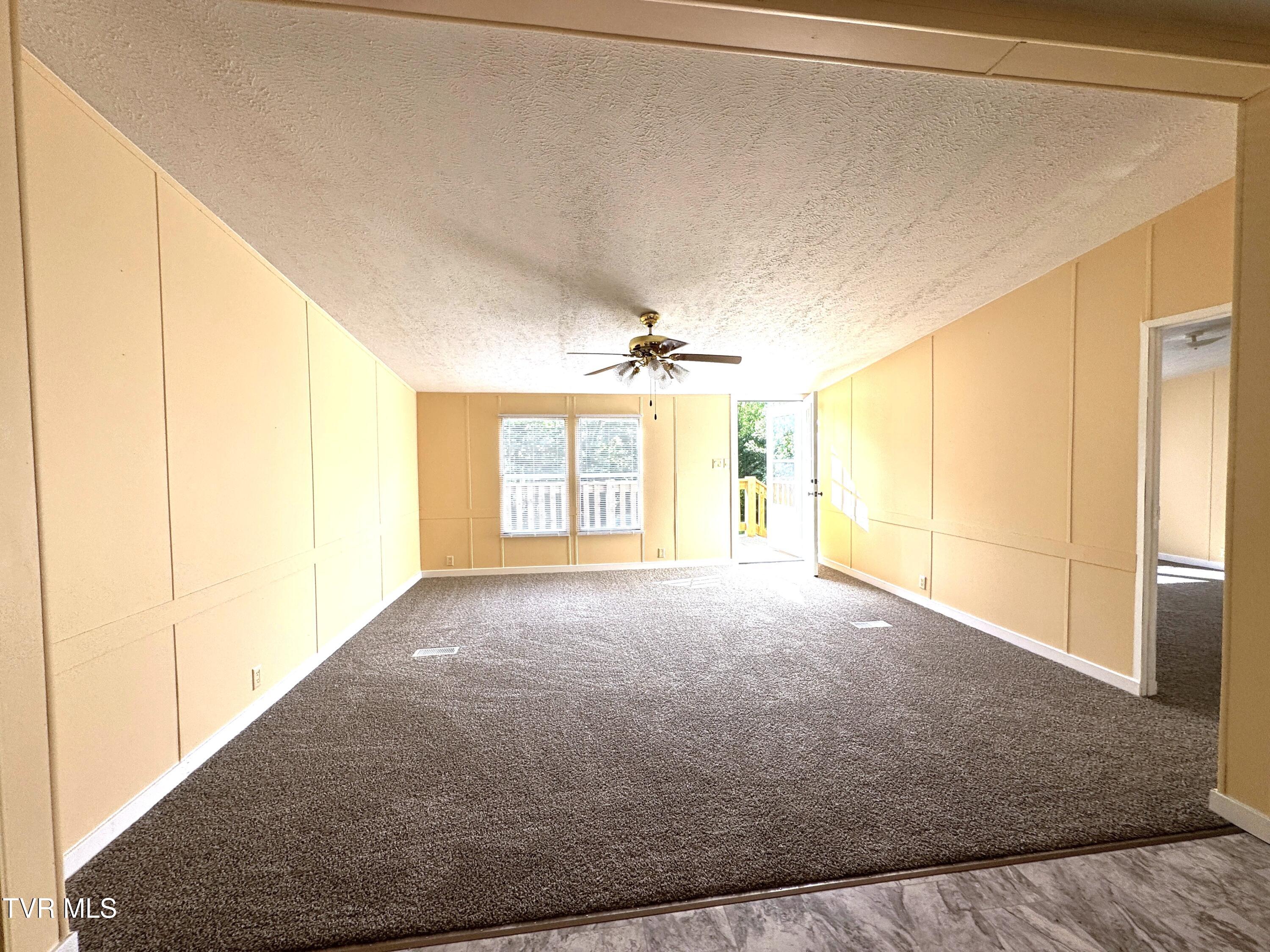 1555 Hamner Hollow Road Big Stone Gap, VA 24219 - Photo 12 of 41 LIVING ROOM TOWARD FRONT DOOR