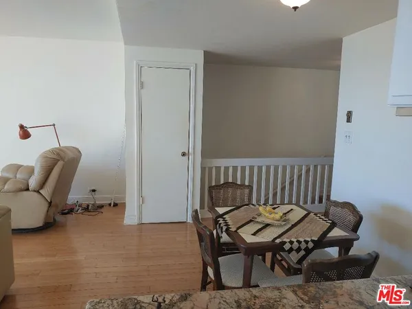 a kitchen with granite countertop stainless steel appliances a refrigerator and a sink
