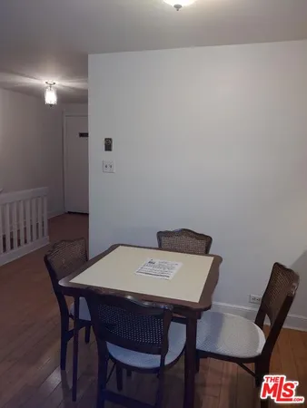 a room with table and wooden floor