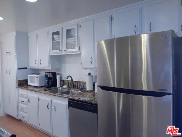 a living room with furniture and a lamp