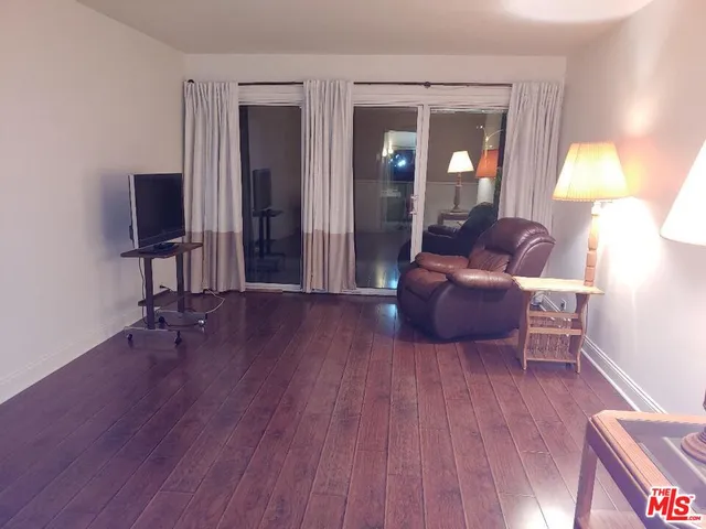 a bathroom with double sink and a mirror