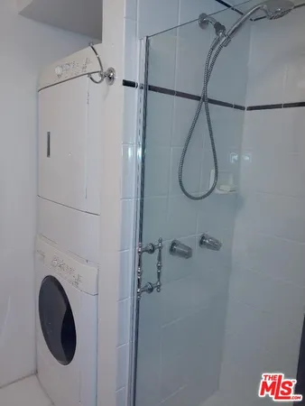 a view of a swimming pool with sitting area