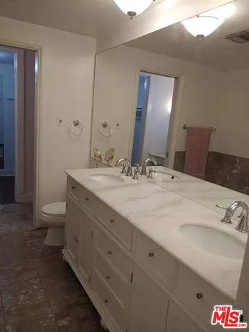 a view of a patio with swimming pool table and chairs
