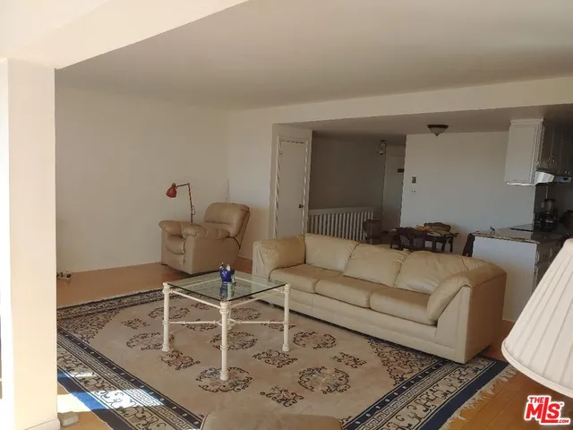 a view of a room with furniture and a window