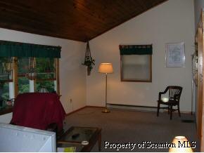 853 Spring Hill Road Sterling, PA 18463 - Photo 2 of 5 a living room with furniture