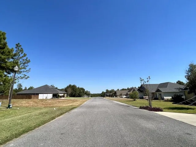 a view of a swimming pool with a yard