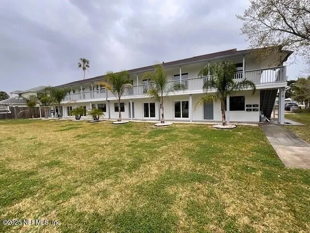 a view of a building with a big yard