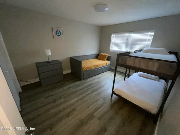 a room with furniture and a wooden floor