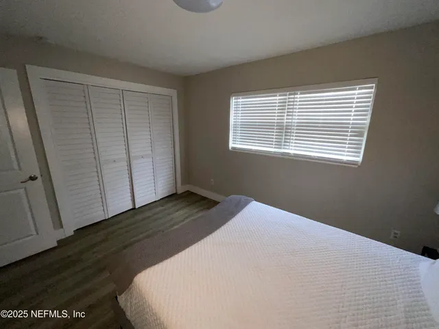 a bathroom with a sink a toilet and shower curtain