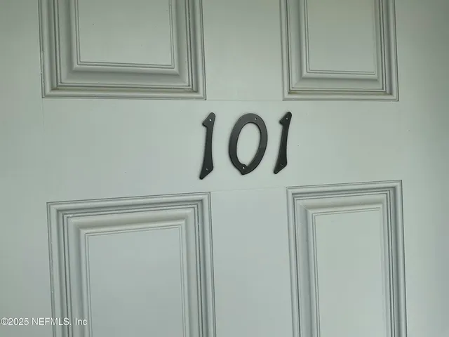 a dining room with furniture and a window