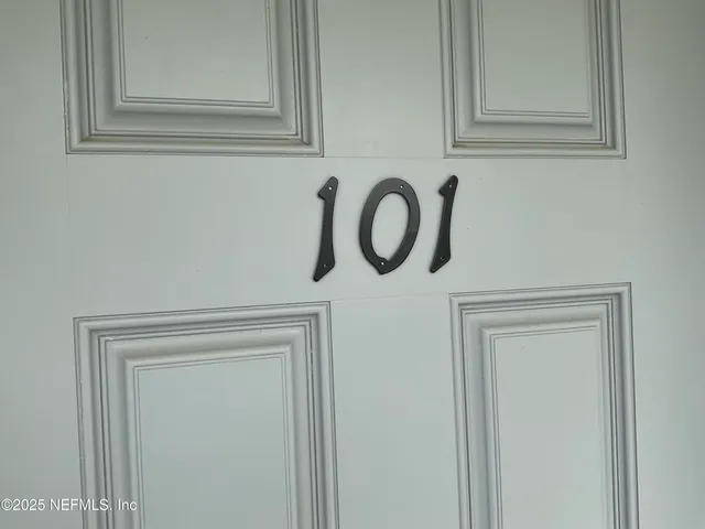 a dining room with furniture and a window