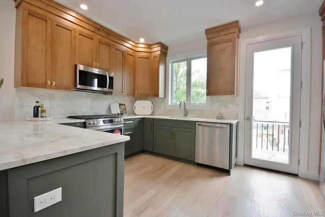 a kitchen with a sink cabinets and window