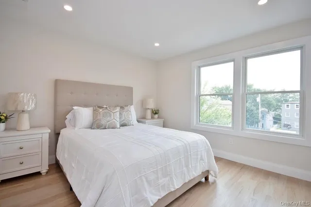 a bedroom with a large bed and a window