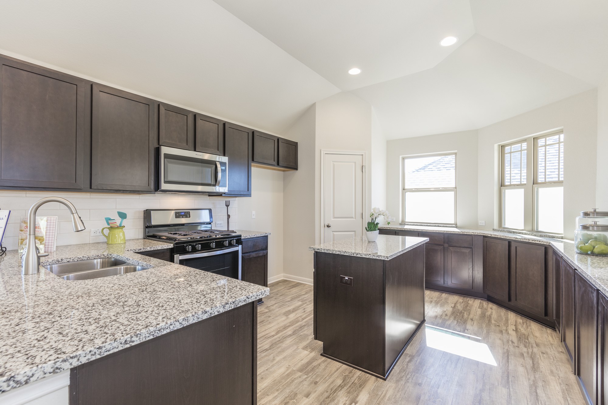 2725 Hopi Path Leander, TX 78641 - Photo 19 of 30 Well-appointed kitchen showcases granite counters and modern stainless steel appliances.
