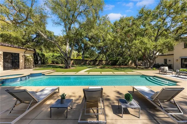 a bathroom with a toilet a sink and shower