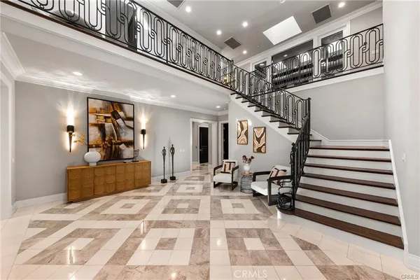 a view of a dining room with furniture large windows and wooden floor