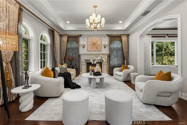 a view of a livingroom with furniture and chandelier