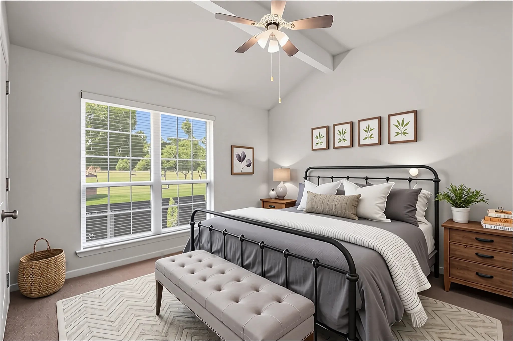 34334 Howell Road Waller, TX 77484 - Photo 16 of 37 Enjoy a tranquil atmosphere in this bedroom, featuring a vaulted ceiling and a large window that brings the beauty of the backyard indoors.