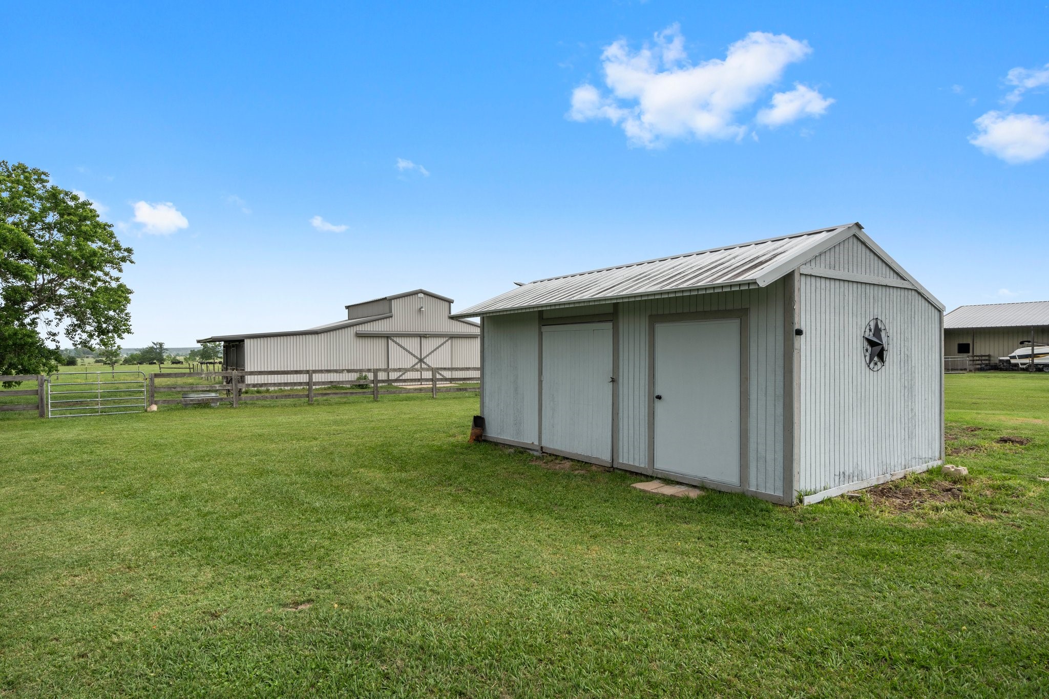 34334 Howell Road Waller, TX 77484 - Photo 30 of 37 Property includes multiple outbuildings for additional storage and utility.