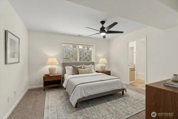 a bedroom with bed and window