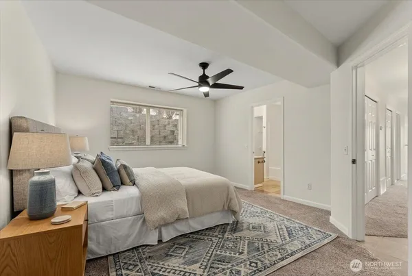a bedroom with a bed and window