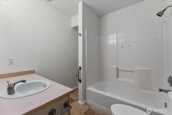 a bathroom with a sink and a bathtub