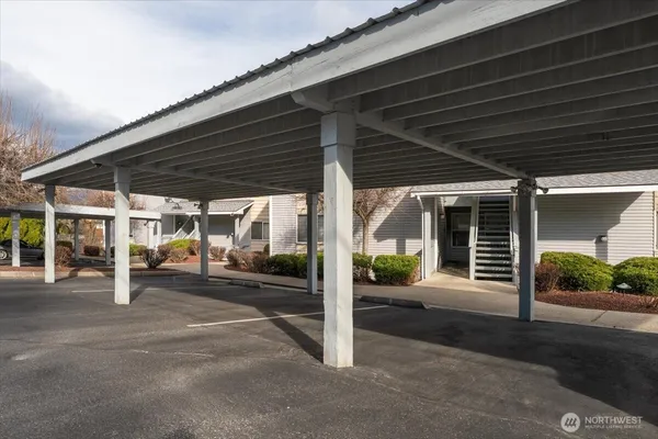 a view of a house with porch and garden