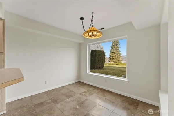a view of a hallway with a window