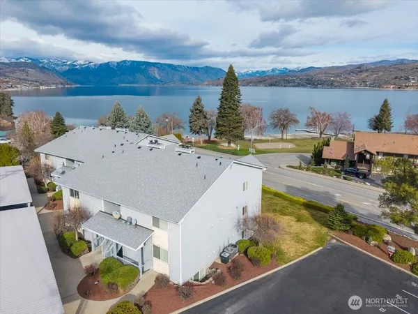 an aerial view of a house with outdoor space