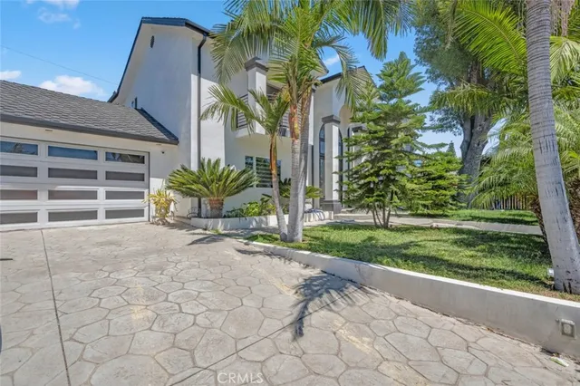 a house with a yard and balcony
