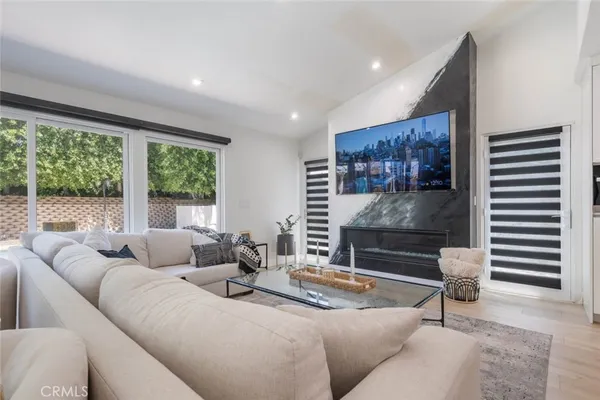 a living room with furniture and a large window