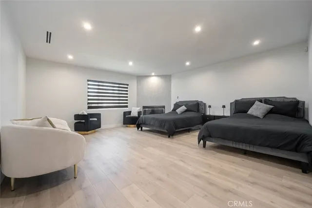 a living room with furniture ceiling fan and a window